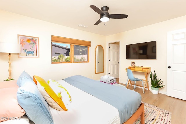 bedroom with ceiling fan and light hardwood / wood-style floors