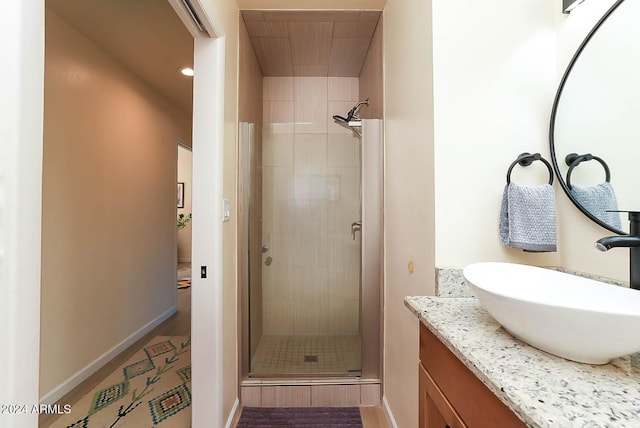 bathroom with vanity and an enclosed shower