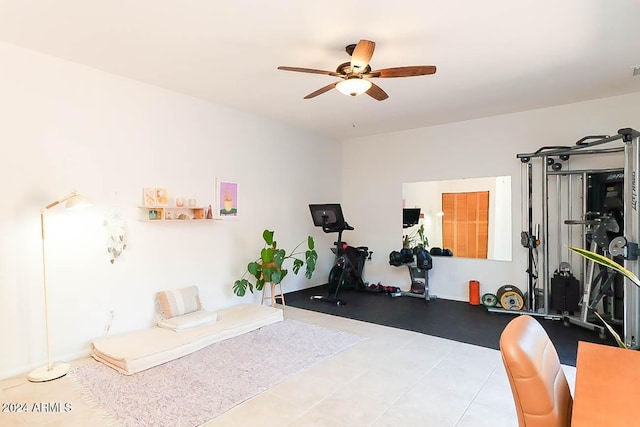 workout room with tile patterned flooring and ceiling fan