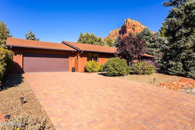 single story home with a garage