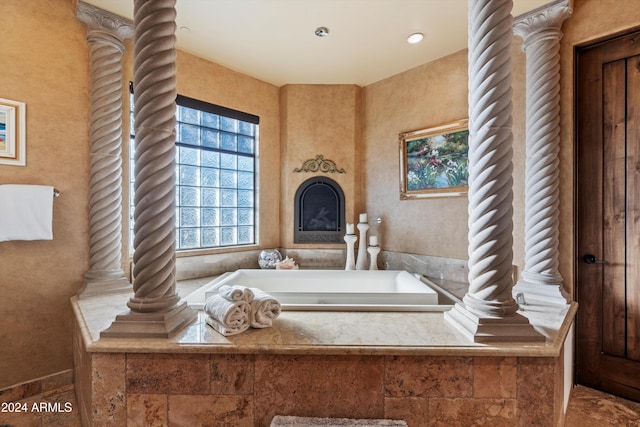 bathroom featuring tiled tub