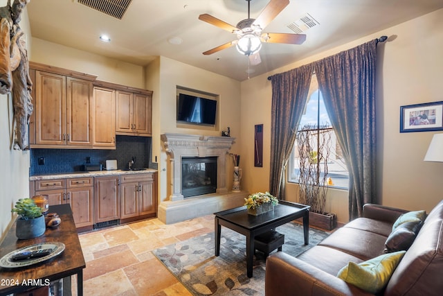 living room with sink and ceiling fan