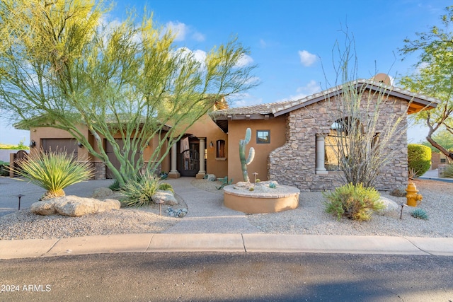 view of front of property with a garage