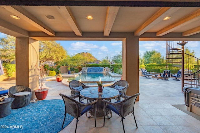 view of patio / terrace with pool water feature