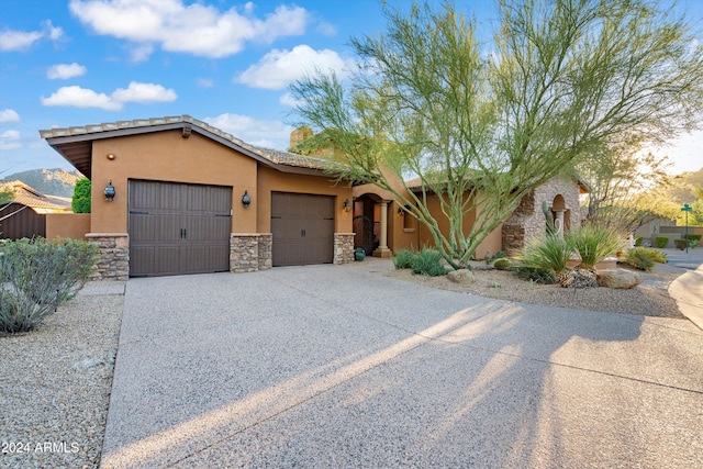 view of front of property with a garage