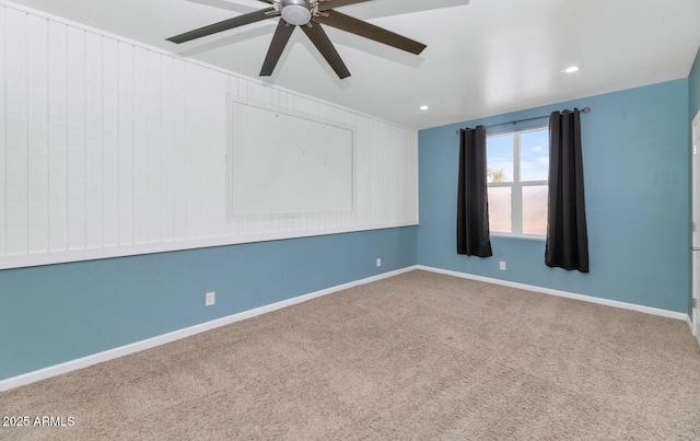 carpeted empty room featuring ceiling fan