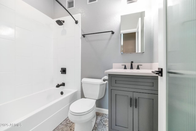 full bathroom featuring washtub / shower combination, vanity, and toilet