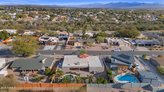 birds eye view of property with a mountain view