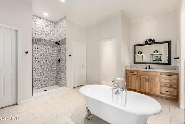 full bath featuring marble finish floor, a freestanding bath, ornamental molding, vanity, and a walk in shower