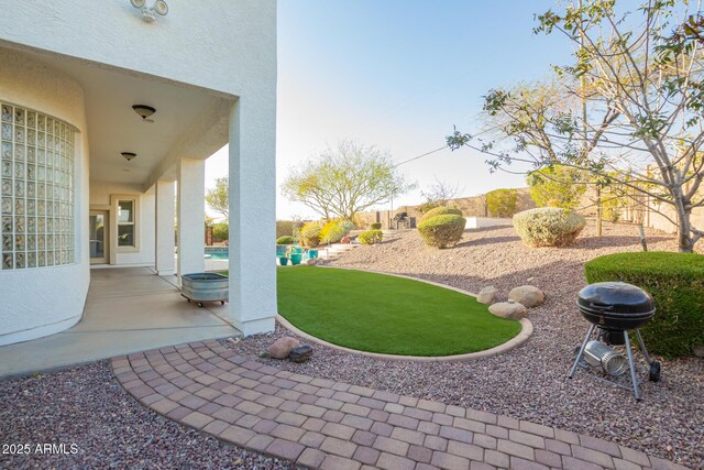 view of yard with a fenced backyard and a patio