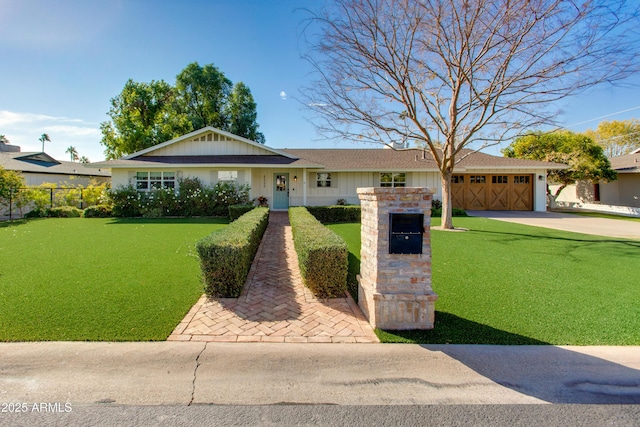 ranch-style home featuring a garage and a front lawn