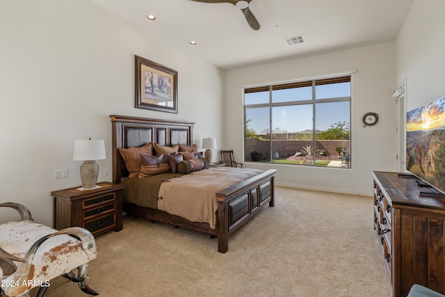 bedroom featuring ceiling fan and light carpet