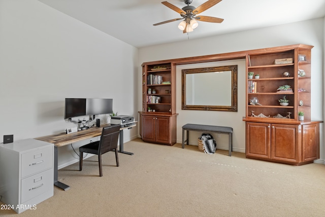 office featuring light carpet and ceiling fan