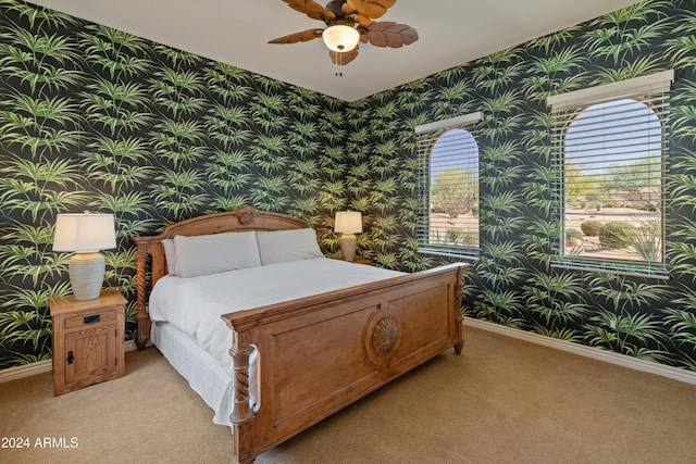 bedroom with light carpet and ceiling fan