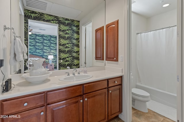 full bathroom featuring vanity, shower / tub combo with curtain, toilet, and tile patterned flooring