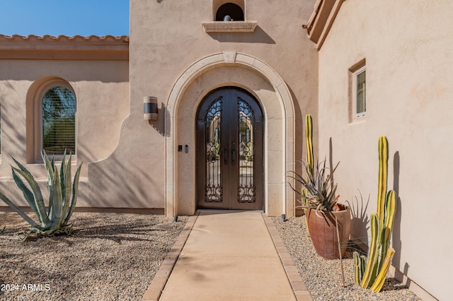 property entrance featuring french doors