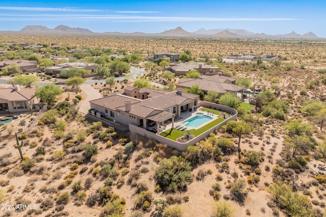 birds eye view of property featuring a mountain view