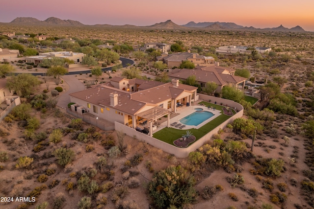 aerial view at dusk with a mountain view