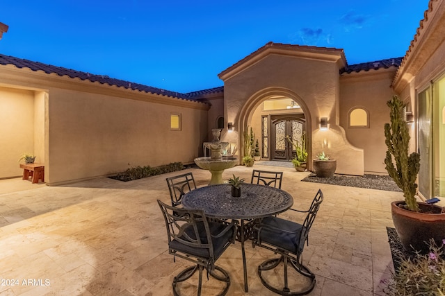 patio terrace at dusk with french doors