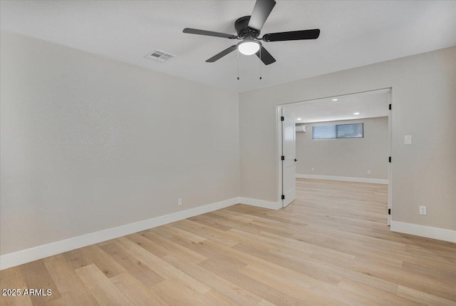 3846 W Cavalier Dr, Phoenix, AZ 85019 - spare room featuring visible vents, baseboards, a ceiling fan, and light wood-style flooring