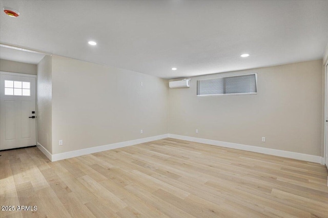 3846 W Cavalier Dr, Phoenix, AZ 85019 - basement featuring baseboards, recessed lighting, light wood-style floors, and a wall unit AC