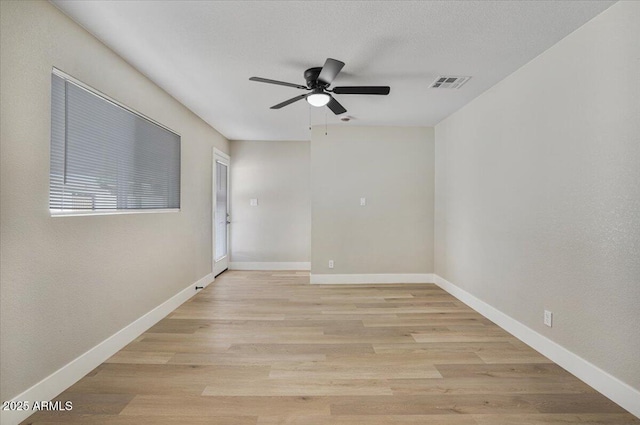 3846 W Cavalier Dr, Phoenix, AZ 85019 - unfurnished room with light wood-style flooring, visible vents, ceiling fan, and baseboards