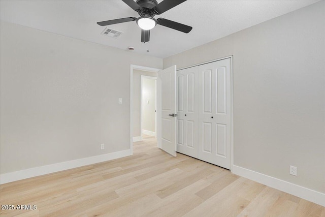 3846 W Cavalier Dr, Phoenix, AZ 85019 - unfurnished bedroom featuring visible vents, baseboards, a closet, and wood finished floors