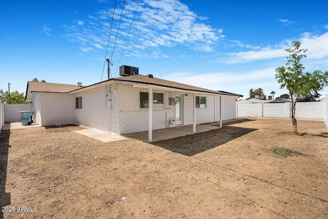 3846 W Cavalier Dr, Phoenix, AZ 85019 - back of house with central air condition unit, a patio, a fenced backyard, and concrete block siding
