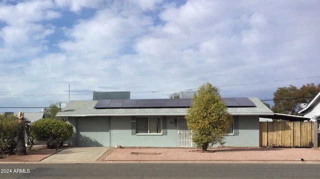 view of front facade with solar panels