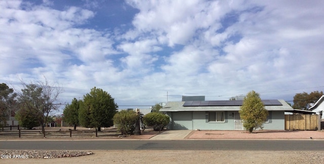 view of front of home featuring solar panels