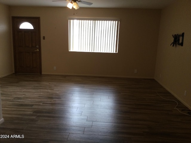 foyer with dark wood-type flooring and ceiling fan