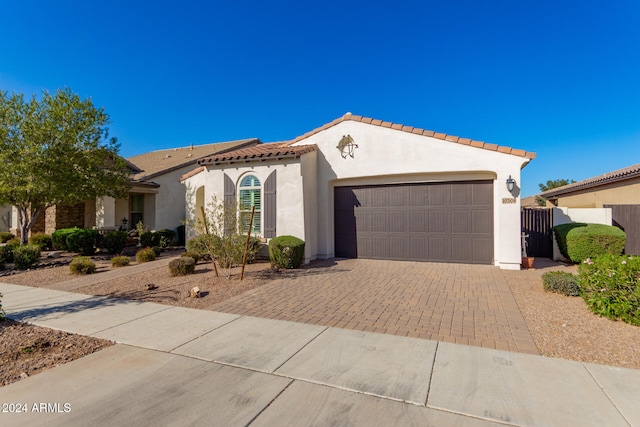 mediterranean / spanish-style house featuring a garage