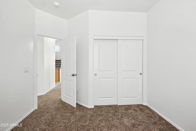 2109 E Fraktur Rd, Phoenix, AZ 85040 - unfurnished bedroom featuring dark carpet and a closet