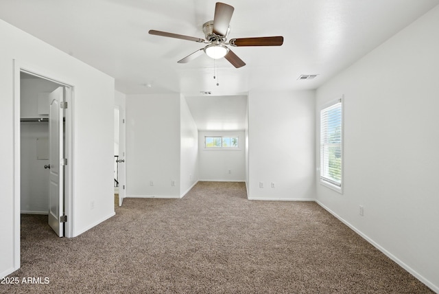 2109 E Fraktur Rd, Phoenix, AZ 85040 - unfurnished bedroom featuring a spacious closet, carpet flooring, and ceiling fan
