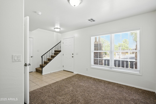 2109 E Fraktur Rd, Phoenix, AZ 85040 - foyer featuring stairway, light carpet, and light tile patterned floors