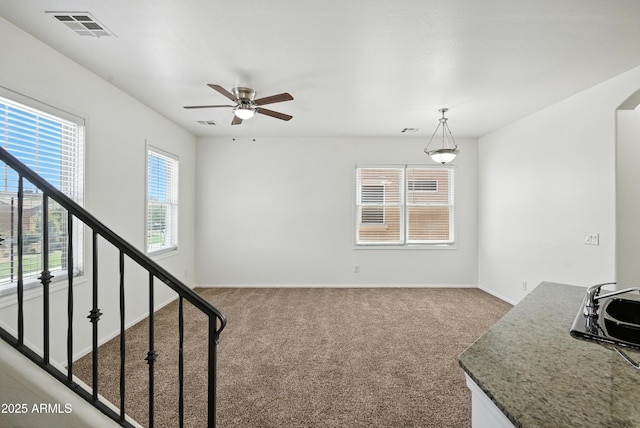 2109 E Fraktur Rd, Phoenix, AZ 85040 - unfurnished living room with carpet and ceiling fan