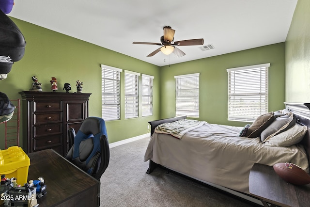 bedroom featuring a ceiling fan, carpet flooring, visible vents, and baseboards