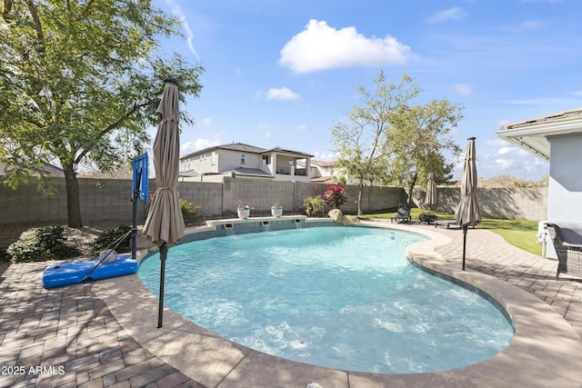 view of swimming pool featuring a fenced in pool, a patio area, and a fenced backyard