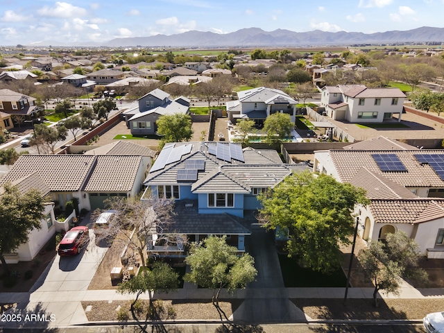 drone / aerial view with a residential view and a mountain view