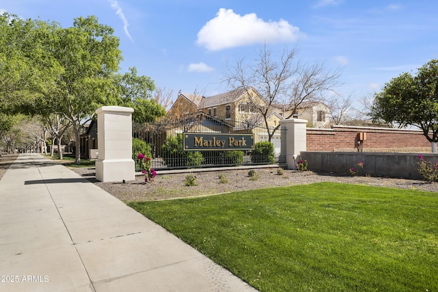 exterior space with fence and a lawn