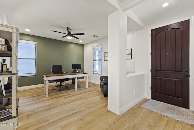 office featuring light wood-style flooring, visible vents, baseboards, and recessed lighting