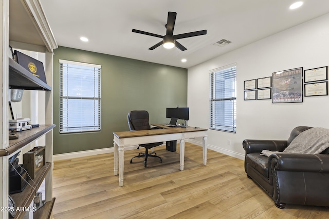 office with light wood-style floors, baseboards, visible vents, and recessed lighting