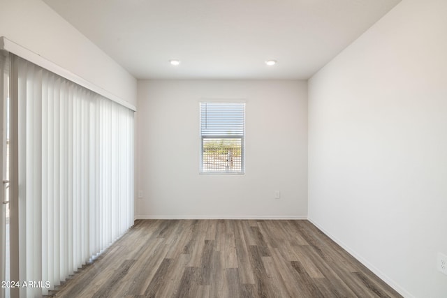 empty room with hardwood / wood-style floors