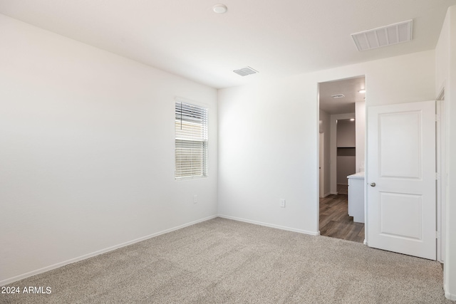 empty room with carpet flooring