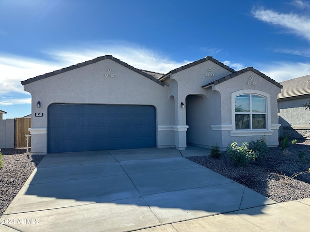 view of front of property with a garage