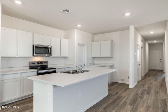 kitchen featuring appliances with stainless steel finishes, an island with sink, white cabinetry, and sink