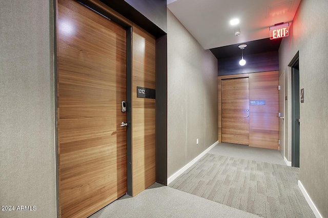 corridor with light colored carpet