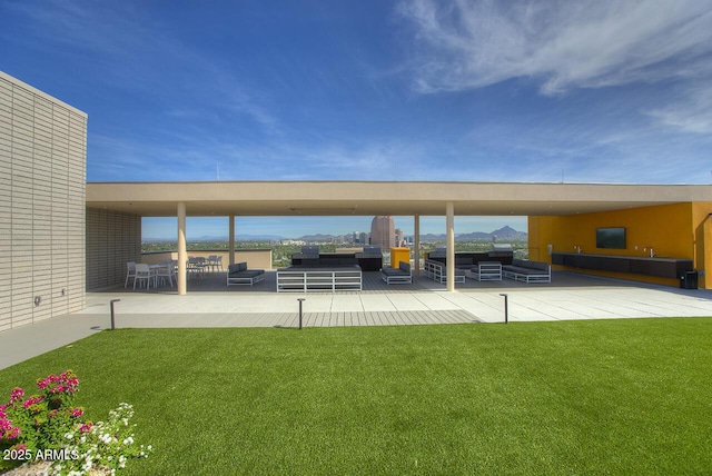 view of yard featuring an outdoor living space and a patio