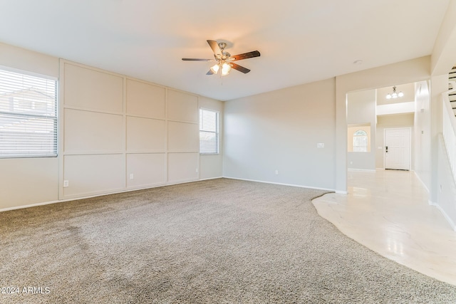 carpeted empty room with ceiling fan