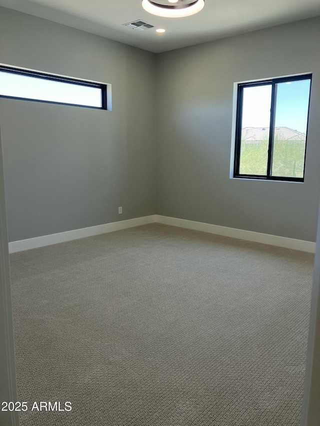4079 E Roosevelt St, Apache Junction, AZ 85119 - carpeted empty room with baseboards